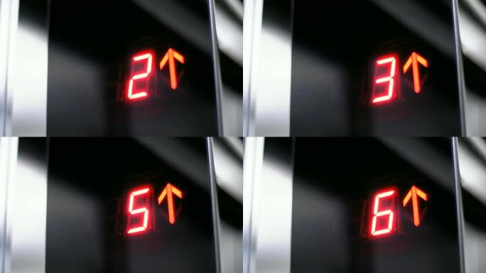 电梯中的数字显示，该电梯在地板上升起，箭头向上