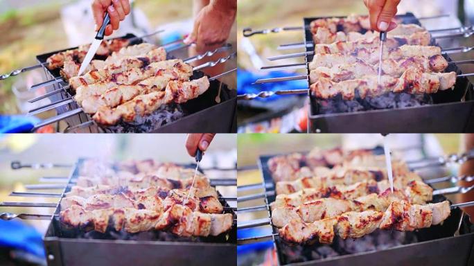 腌制的shashlik在木炭上的烧烤架上准备。在夏季户外聚会上，男人在烧烤架上为他的朋友做饭。4K 