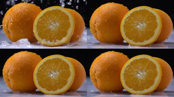 水在慢动作中溅到橙色水果上。