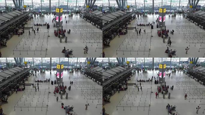 旅客人群，机场柜台大厅的游客