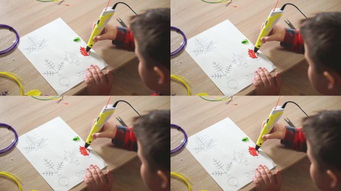 十几岁的男孩使用3D笔。他用红色ABS塑料创造了一片植物叶子。