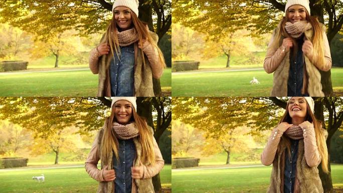 女人放松享受秋天的秋天公园