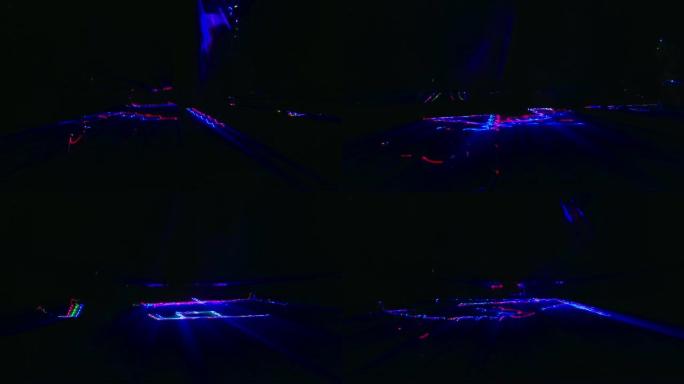 抽象激光辉光以同心的方式旋转，紫色的彩虹迷幻光谱，迪斯科舞蹈和电子音乐背景，无缝循环
