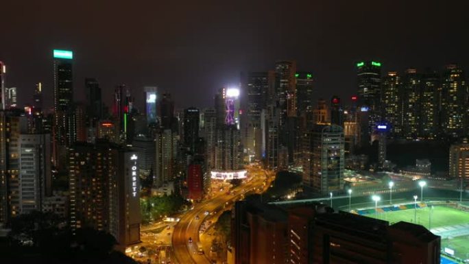 夜间照明城市著名体育场综合交通道路空中全景4k香港