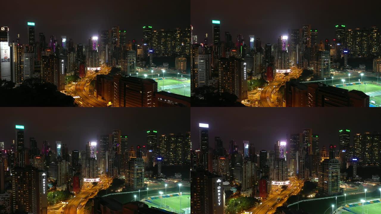 夜间照明城市著名体育场综合交通道路空中全景4k香港