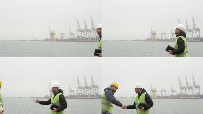 欢迎戴着头盔的港口工人。海港