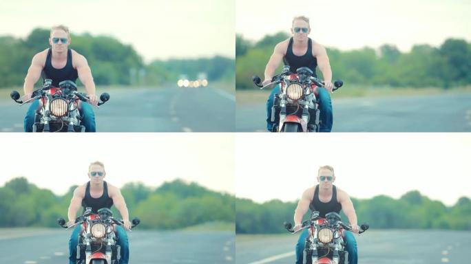 戴墨镜的男子气概摩托车手在高速公路上的摩托车上左转一个大而缓慢。特写肖像