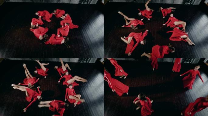 七名女舞者圆圆的躺在地板上，移动并站起来，俯视图在他们的身体上