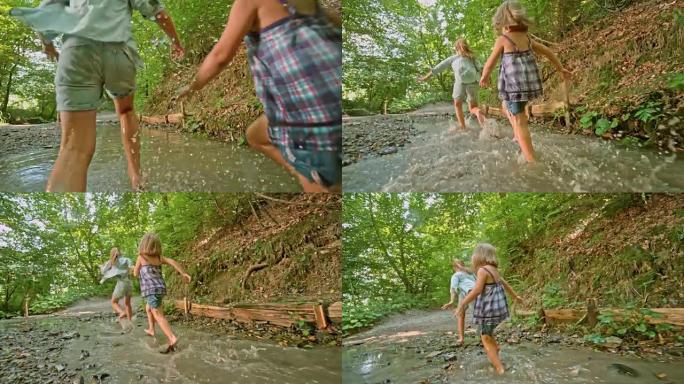 SLO MO两个小女孩赤脚跑过森林里的一条小溪