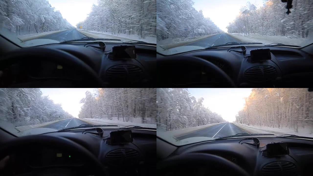 男子在冬季道路上缓慢驾驶汽车。在冬天，大多数驾车者仍然放慢脚步，要小心。