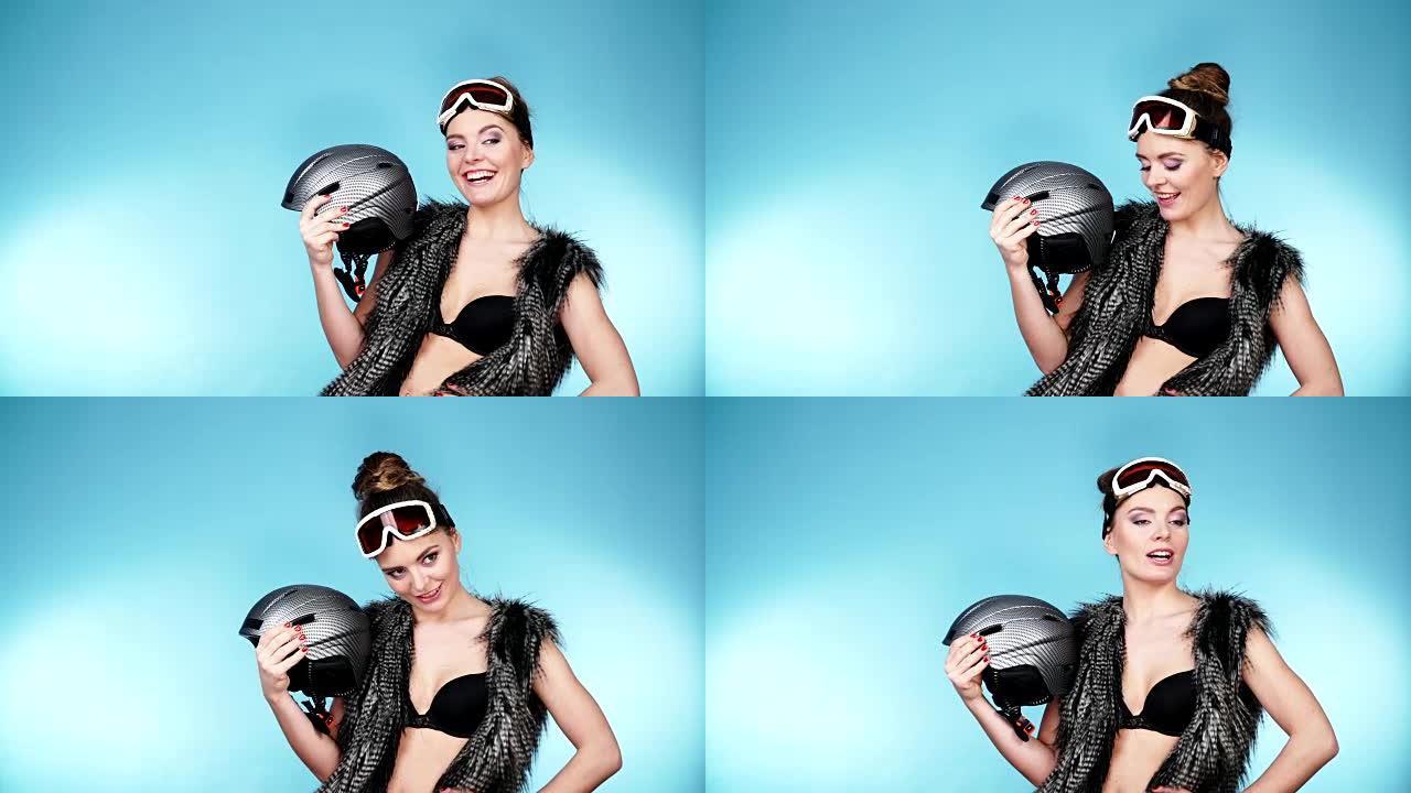 戴滑雪镜的女人戴着头盔。冬季运动4K
