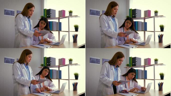 两名年轻的亚洲女医生与放射科医生讨论诊断，在临床，医疗保健和医疗概念中检查x射线