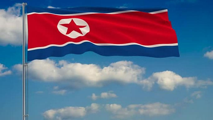 蓝蓝的天空中飘浮着云朵，映衬着朝鲜国旗