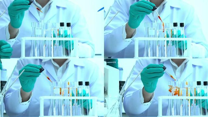 科学家正在试验化学物质的化合物和吸收液体的试管。科学、测试开发和实验室行业的概念。