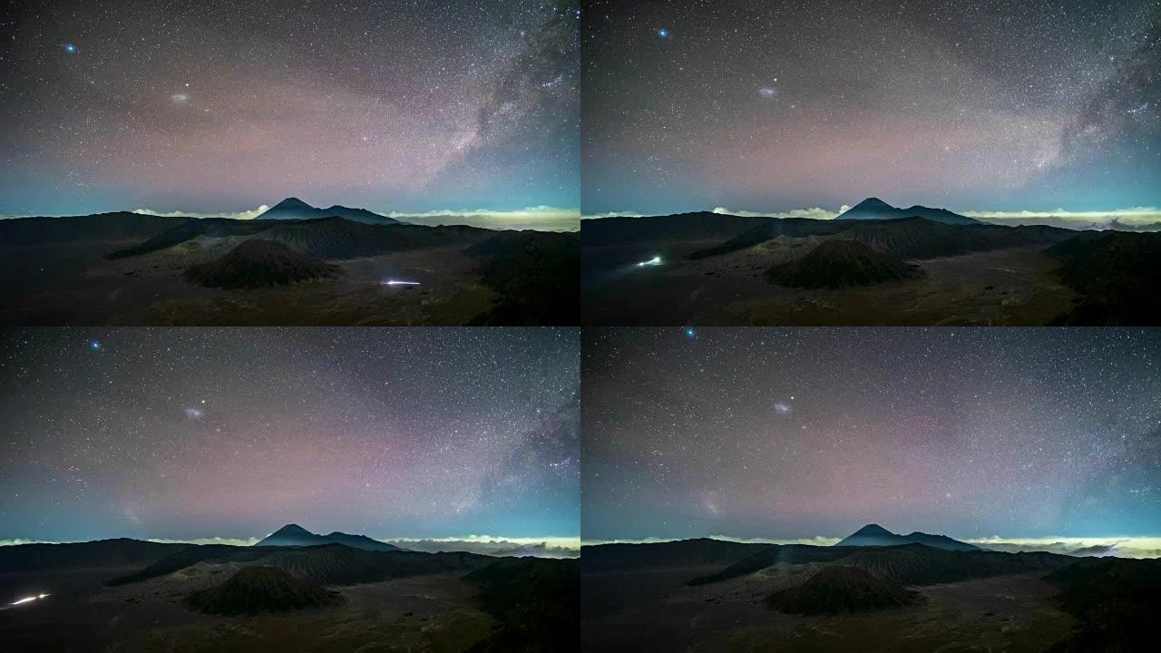 火山的延时在夜间活跃着银河和交通繁忙。印度尼西亚东爪哇省布罗莫腾格尔塞梅鲁国家公园