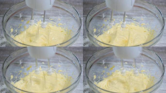 在碗里打蛋糕黄油，特写。