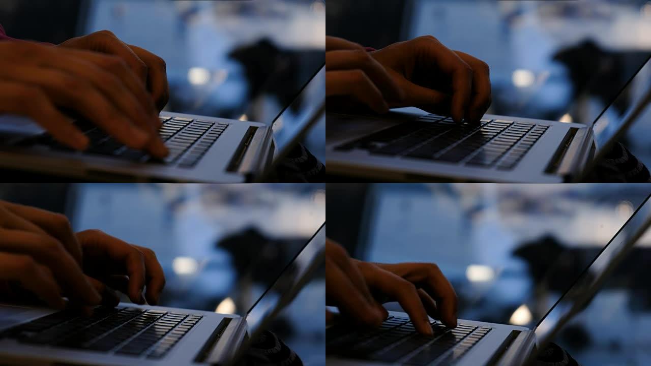 女人手在笔记本电脑上的键盘上打字在飞机背景上的机场的窗户旁，浮动焦点