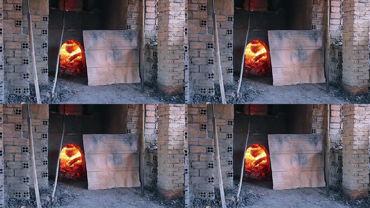 关闭用木头烧制的窑炉以烘烤砖块。(砖厂)