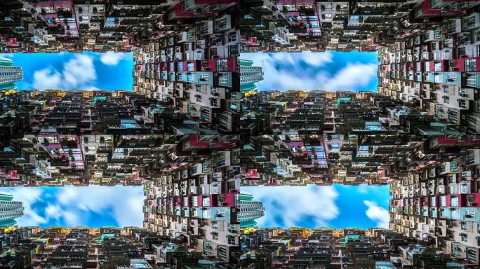 4k延时电影香港鲗鱼涌一个旧社区拥挤住宅塔楼的低角度移动云