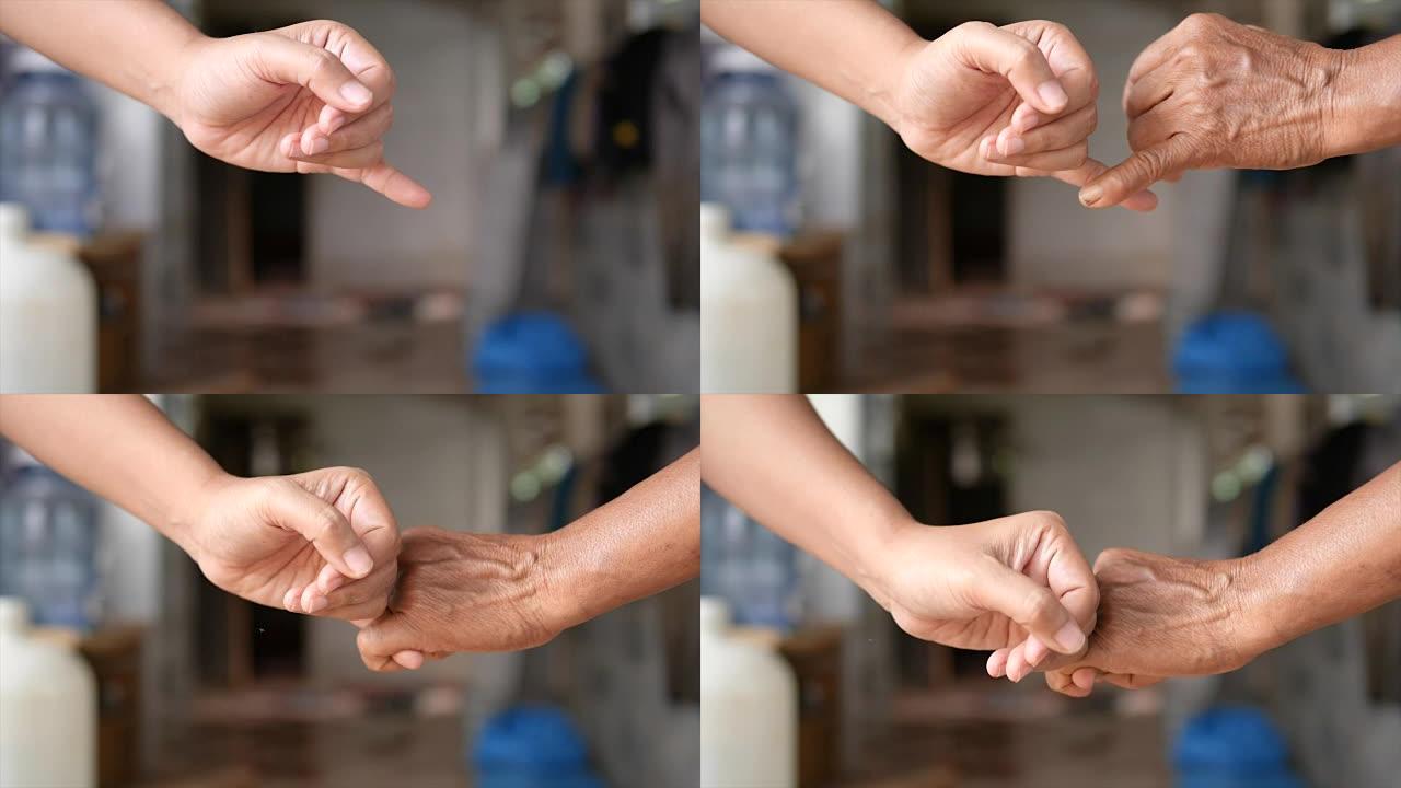 女孩和年轻女人的手手牵手隐喻联系承诺和承诺