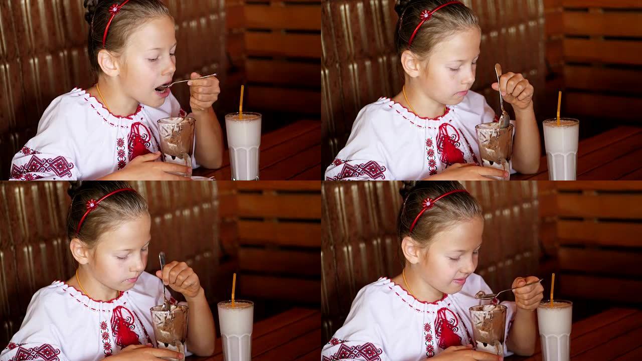 快乐微笑的少女，孩子在咖啡馆吃冰淇淋。她穿着乌克兰民族服装，刺绣，维希万卡