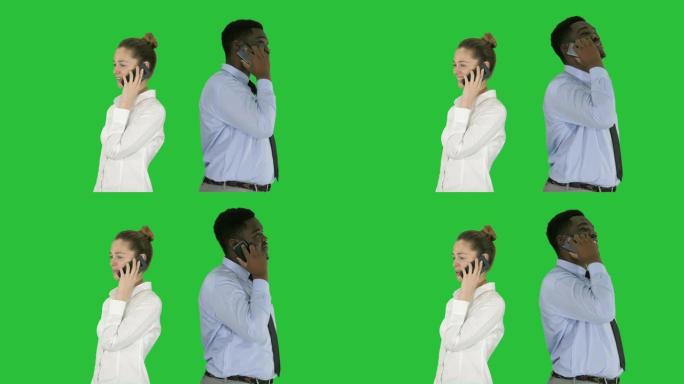 年轻的非洲裔美国男女背靠背站在绿屏上打电话，色键