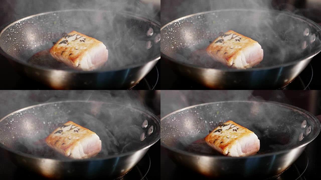 煎鱼，金枪鱼片在慢动作的蒸锅上。