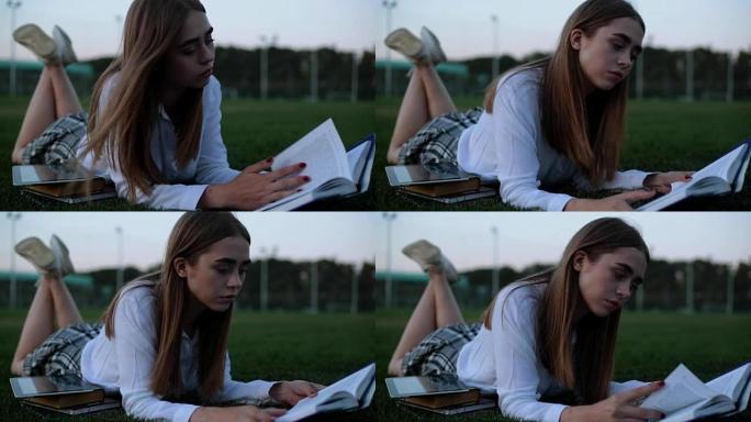 女学生在公园读书。