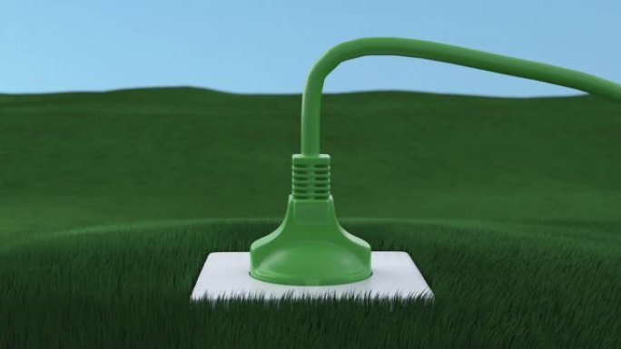 连接到草地上白色插座的插头的前视图