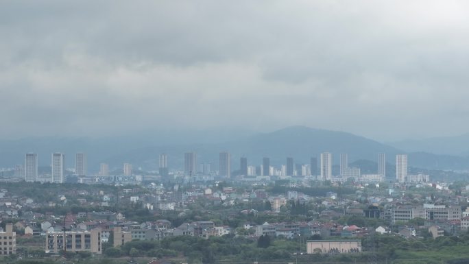 航拍浙江绍兴诸暨暨南街道高楼建筑远景雨天