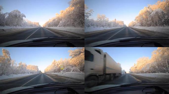 男子在冬季道路上缓慢驾驶汽车。在冬天，大多数驾车者仍然放慢脚步，要小心。