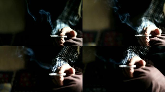 靠近香烟或烟草与烟在手中和拷贝空间