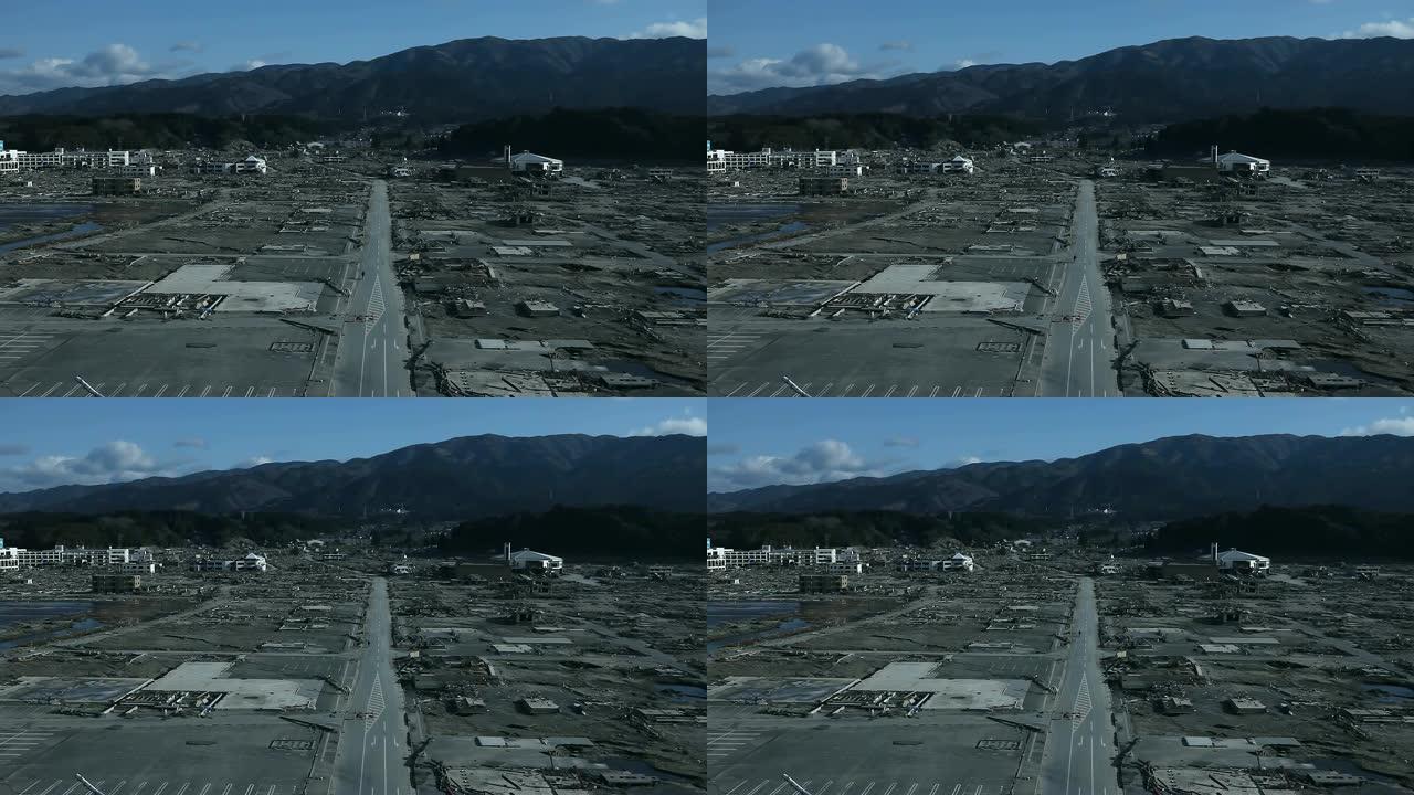 海啸后福岛公路的鸟瞰图。背景中的山