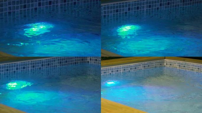 游泳池上蓝光的水反射