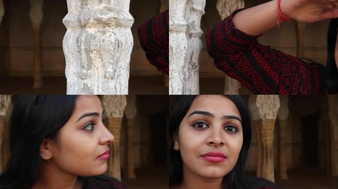 手持拍摄的女人等待看搜索远在她的智能手表手机手机触摸屏微笑发现在古老的古印度寺庙门面背景进入框已故情