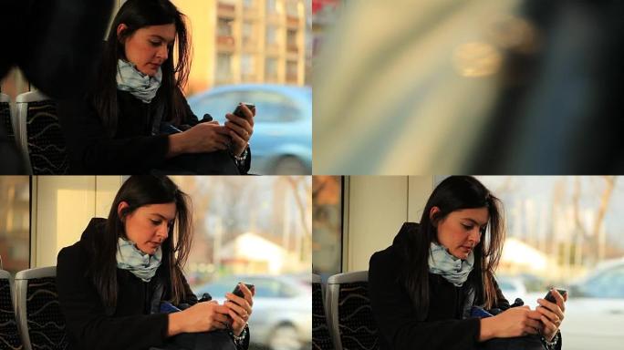 女人在乘电车上下班时看着手机。通勤者以智能手机技术为主角