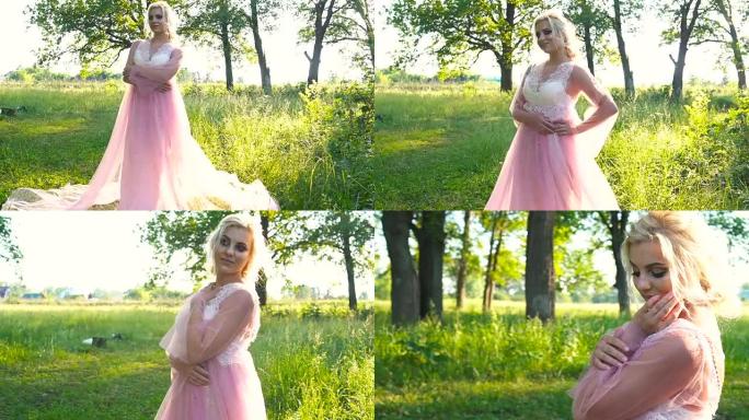 穿着浅粉色连衣裙的美丽浪漫女人在晨间森林里摆姿势。美丽，时尚