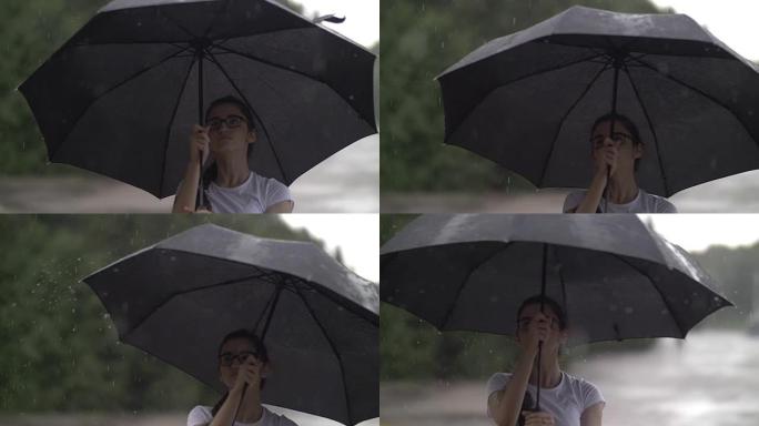 女孩在下雨的天气中扭曲雨伞，看起来像雨滴打伞，秋天的心情