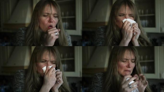 白人妇女患重感冒，在厨房里吹鼻子。