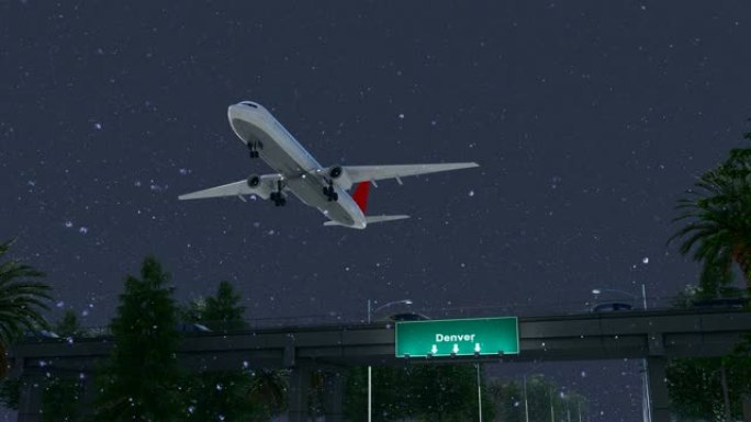 飞机在下雪的夜晚从美国丹佛机场起飞