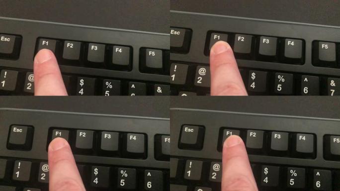 手指按下黑色键盘上的F1键