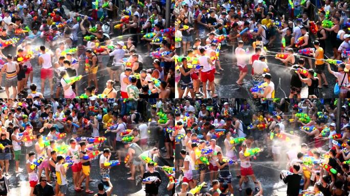 在曼谷西隆路的泼水节上，人们快乐而有趣地玩水。