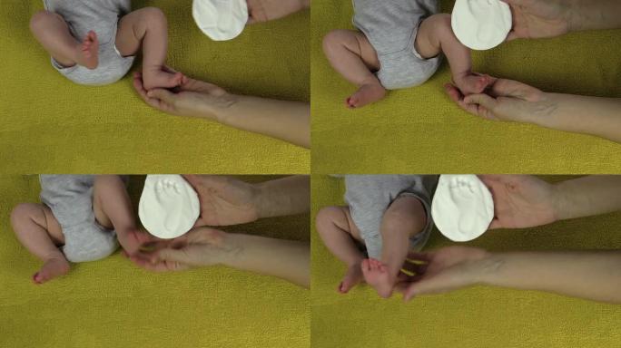 婴儿腿移动，母亲显示新生儿脚印