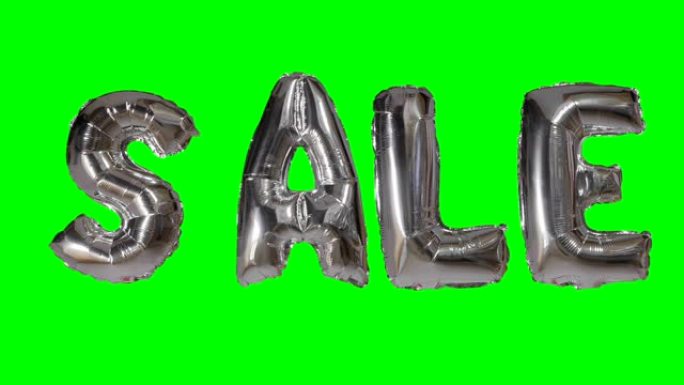 漂浮在绿色屏幕上的氦银气球字母的文字销售