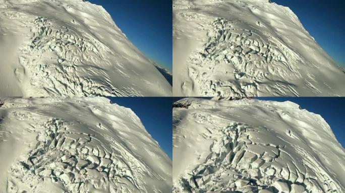 冰冻的冰川苔原裂缝景观在直升机上飞过