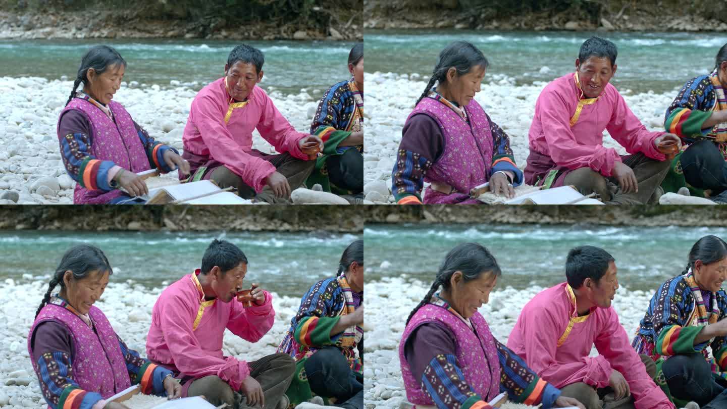 藏族妇女纺线织布男子喝酥油茶劳作生活