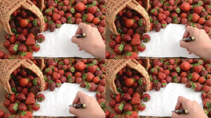 体重秤和便条纸上的草莓篮子