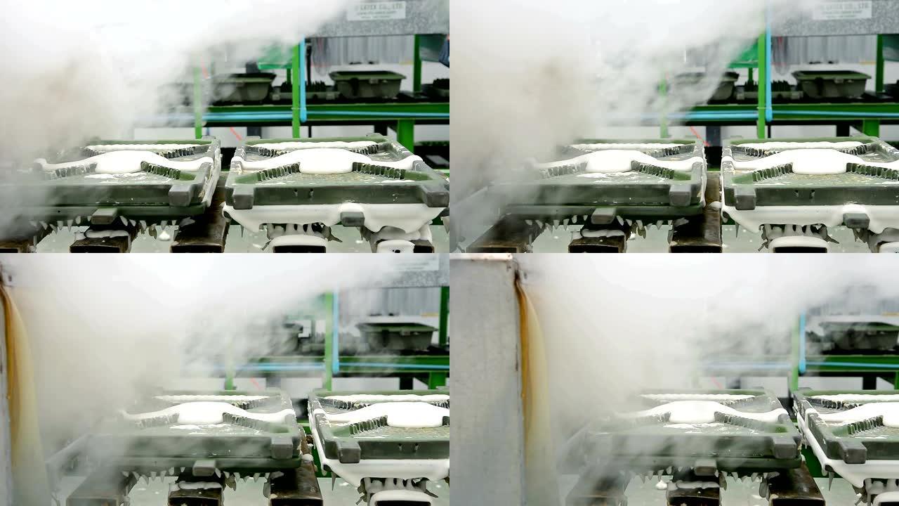 乳胶枕厂用热蒸汽在传送带上移动的金属乳胶枕模具的多莉镜头