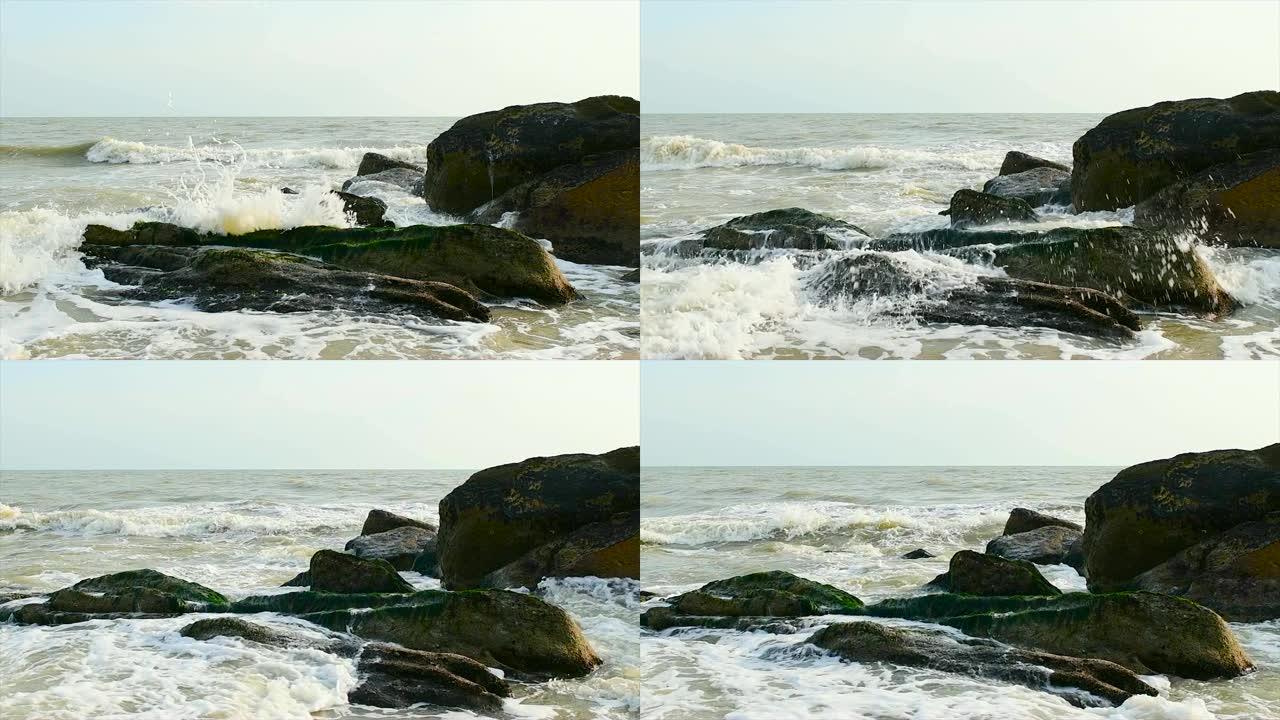巨浪压在岩石上，慢动作