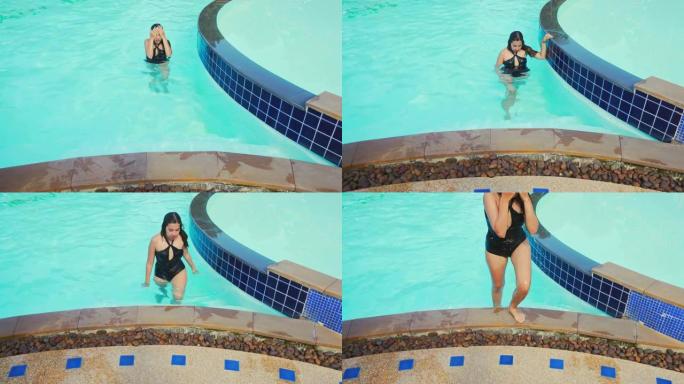 无忧无虑的女人放松游泳池暑假概念